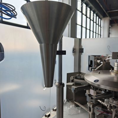 Filling 1 station â stainless steel funnel feeding primary product into the pouch